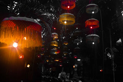 Illuminated lanterns hanging at night