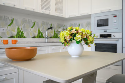 Potted plant on table at home