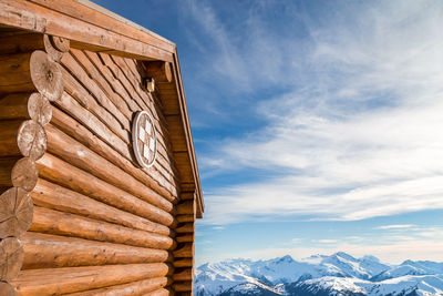 Low angle view of snowcapped mountains against sky