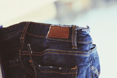 Close-up of leather against blue wall