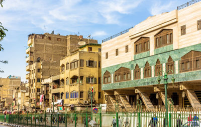 Buildings in city against sky