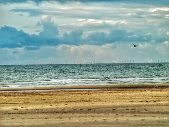 View of calm beach against the sky