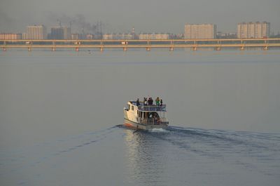 Boat sailing on river against sky