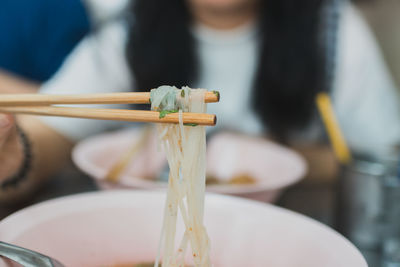 Close-up of hand holding bowl