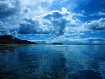 Scenic view of sea against cloudy sky