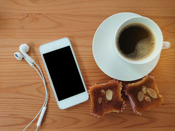 High angle view of coffee cup on table