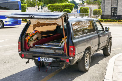 Vehicles on road along buildings