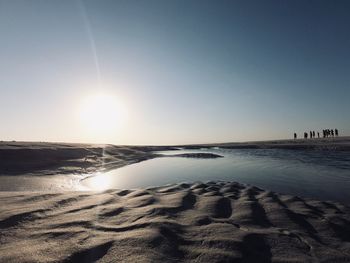 Scenic view of sea against clear sky during sunset