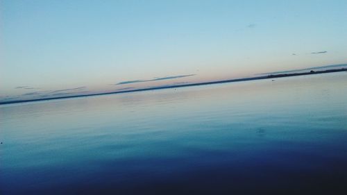 Scenic view of calm sea at sunset