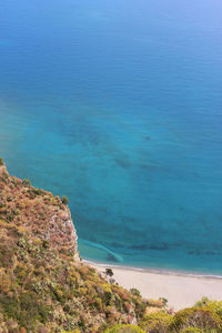 High angle view of sea against blue sky