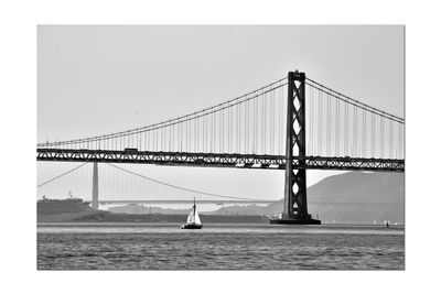 View of suspension bridge over sea