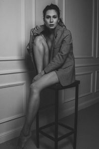 Portrait of a young woman sitting outdoors