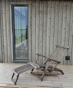 Empty chairs against building