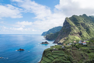 Scenic view of mountains and sea against sky