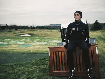 Portrait of man standing on golf course