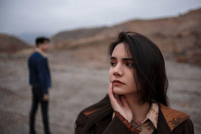 Portrait of young woman looking away