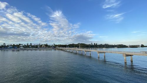 Scenic view of river against blue sky