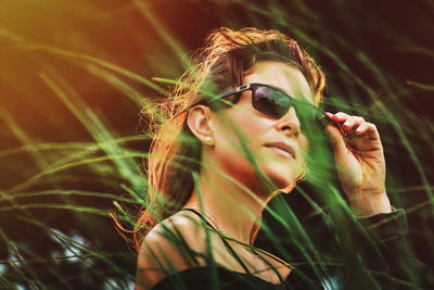 Portrait of young woman wearing sunglasses