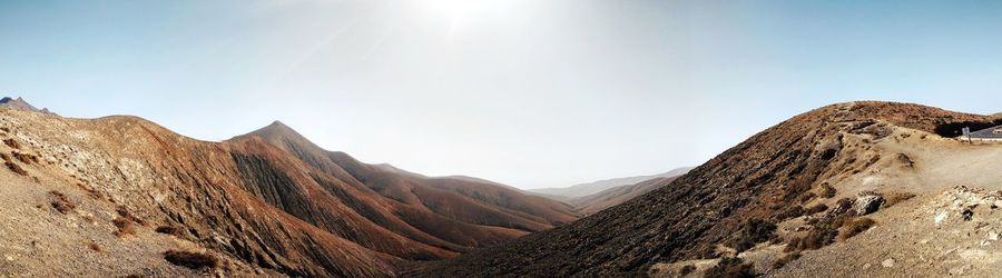 Panoramic view of mountains against clear sky