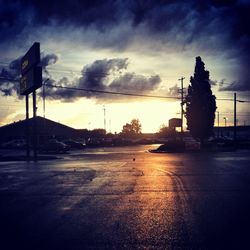 Road against cloudy sky at sunset