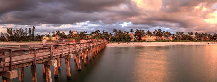 Panoramic shot of bridge over river against sky