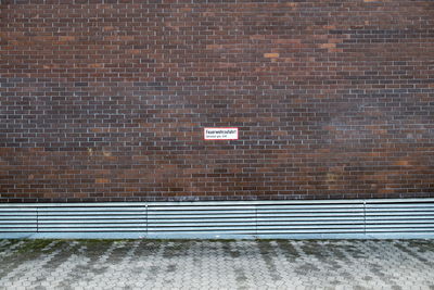 Street against wall with text