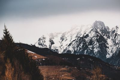 Scenic view of mountains against sky during winter