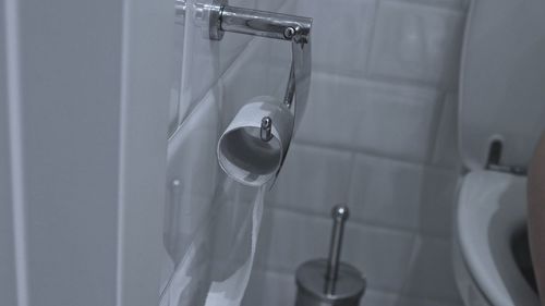 Close-up of faucet in bathroom