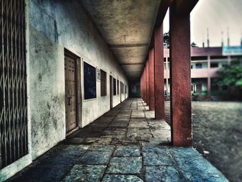 Empty alley amidst buildings