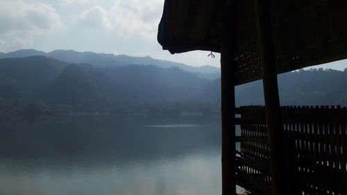 Close-up of lake against mountain range