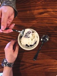 Cropped image of person holding coffee cup