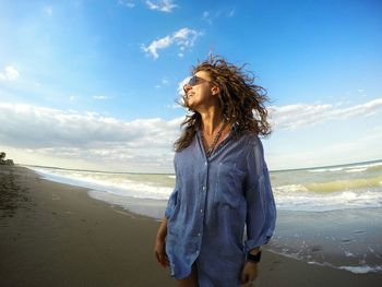 Woman standing on beach