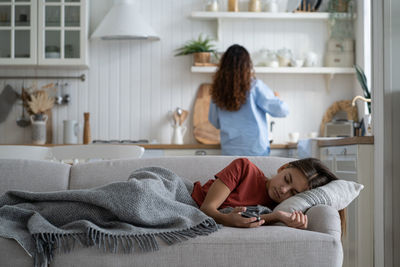 High angle view of mother and daughter at home