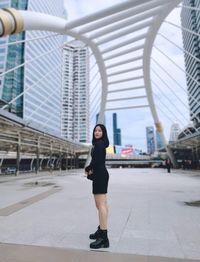 Full length of woman standing in city