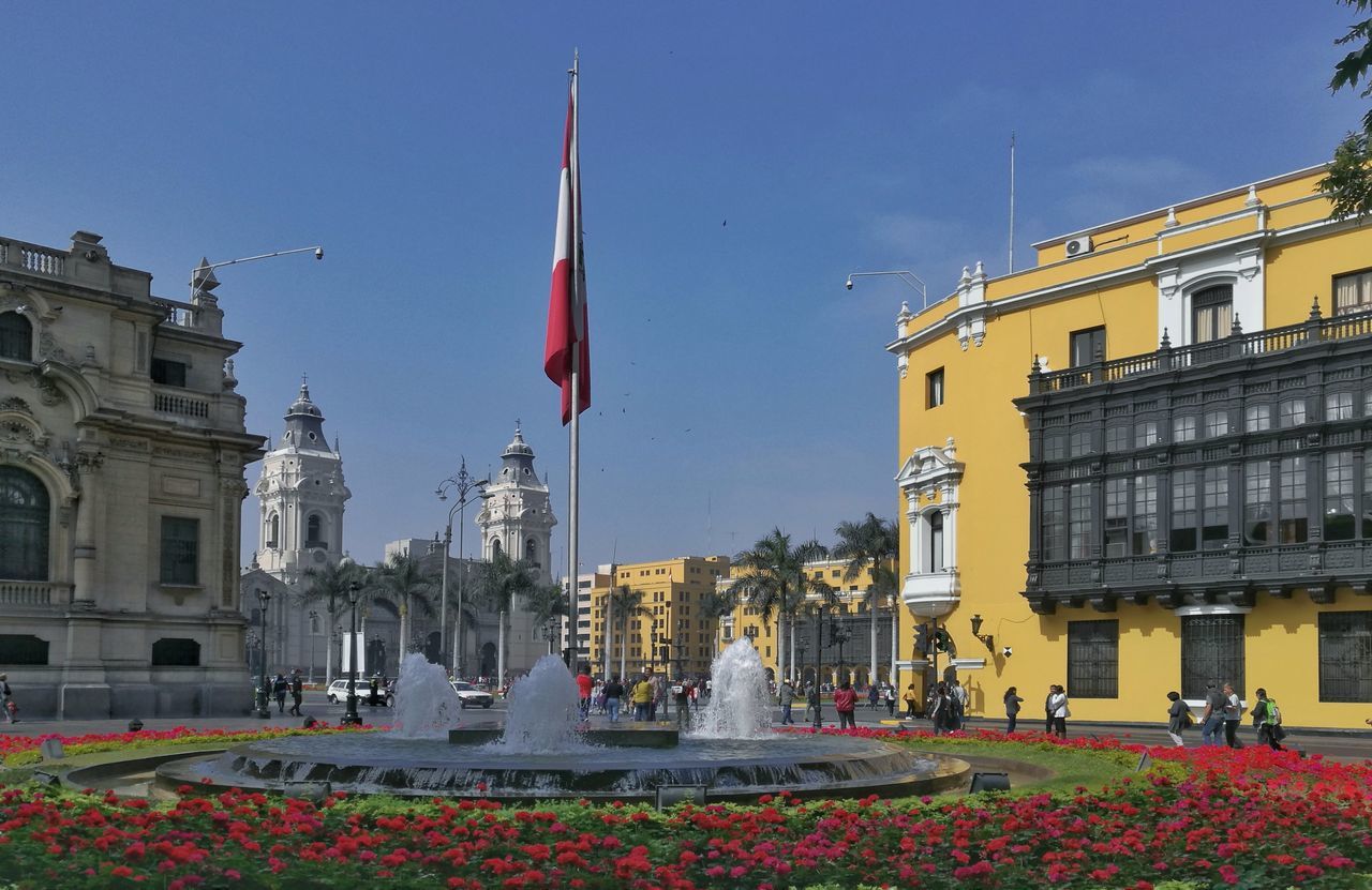 flag, patriotism, building exterior, architecture, built structure, day, outdoors, red, sky, city, no people