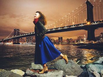 Woman standing on bridge