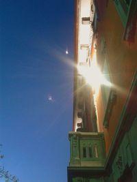 Low angle view of bright sun