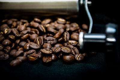 Roasted coffee beans with manual grinder