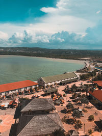 Aerial view of sea against cloudy sky