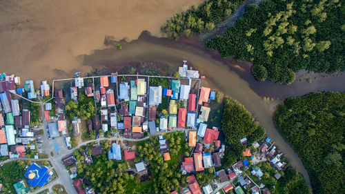 Aerial view of houses amidst trees