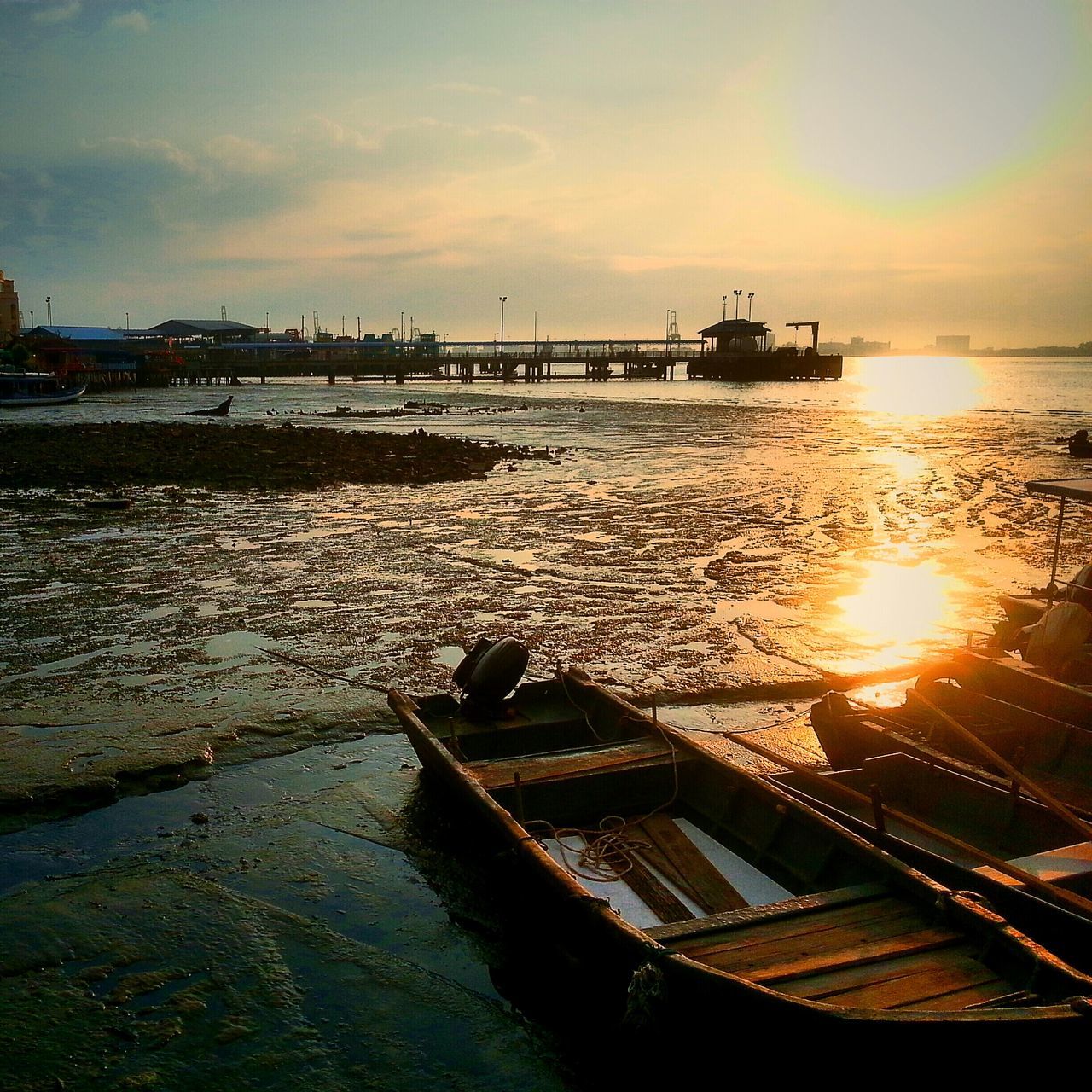 sunset, water, sea, sun, sky, orange color, reflection, scenics, beauty in nature, built structure, beach, tranquil scene, silhouette, sunlight, tranquility, cloud - sky, pier, nature, architecture, horizon over water