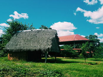 House on field against sky