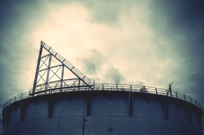 Low angle view of factory against sky