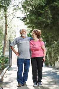 Elderly couple looking at each other