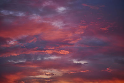 Low angle view of dramatic sky during sunset