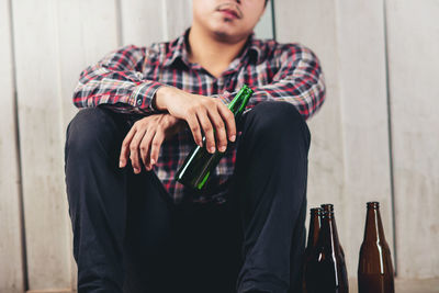 Full length of man sitting at table