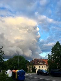 Smoke emitting from car against sky