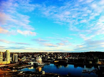 Cityscape against cloudy sky