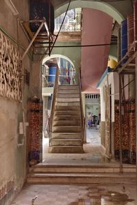 Empty alley amidst buildings in city