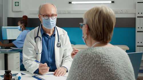 Portrait of female scientist working in clinic